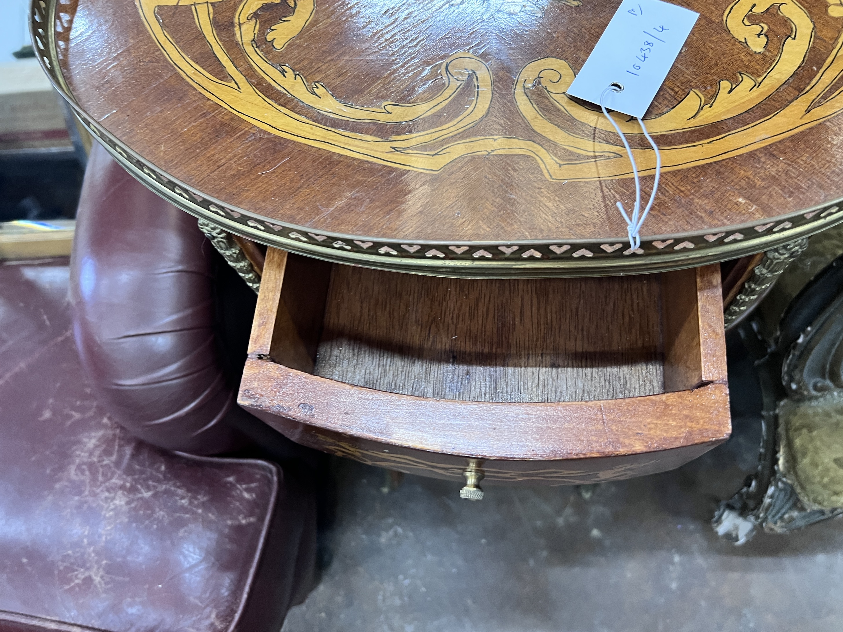 A pair of reproduction Louis XV style oval marquetry inlaid bedside chests, width 47cm, depth 36cm, height 77cm